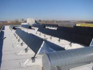 Modular, roof mounted solar air heating system